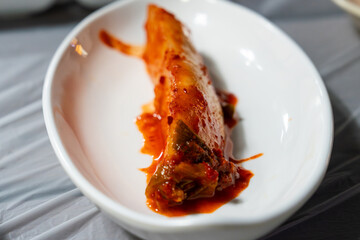 spicy radish kimch on a white dish