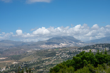 Naklejka premium View from heights of Erice to scenic coastal roads, olive groves, panoramic view on Riserva Naturale Orientata Monte Cofano and Mediterranean sea, travel destination in Italy