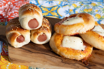 Fresh baked bread, pizza, focaccia or pizzetta with tomatoes, vegetables, sausage and cheese, street food in Palermo, Sicily, Italy, served outdoor for lunch