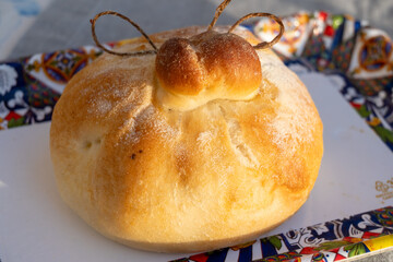 Fresh baked bread in burrata cheese shape filled with tomatoes, vegetables, parmaham and cheese,...