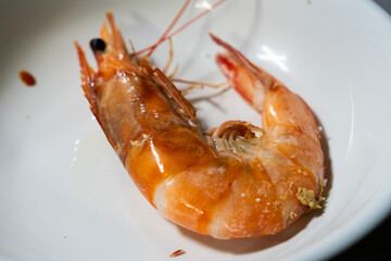 a roasted prawn on a dish