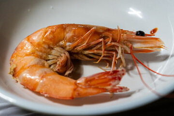 a roasted prawn on a dish