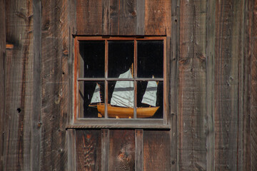 old wooden boat in window