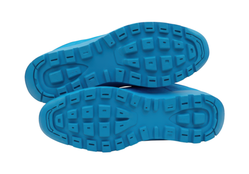 Bright blue shoe soles display deep tread patterns for enhanced grip.