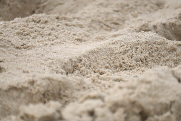 Close-Up of Light Yellow Sand with Small Dunes and Uneven Surface &mdash; Beach Texture