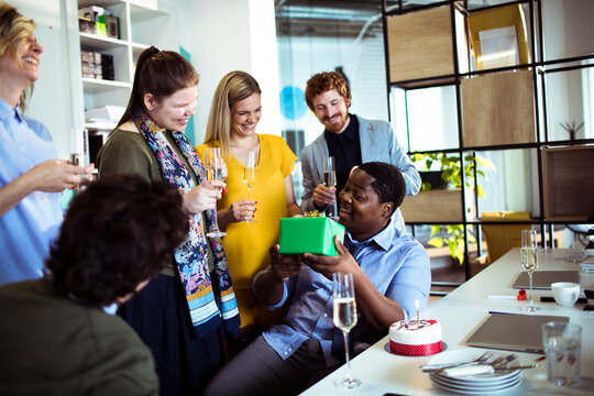 Business colleagues celebrating birthday at office