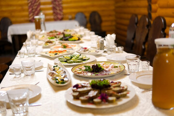 Vibrant Mediterranean feast featuring an array of dishes including wraps, salads, grilled meats, and fresh vegetables. This colorful spread showcases the rich flavors and diverse.