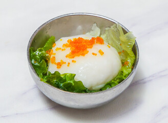 A delectable Scale and Cuttlefish Slipper topped with bright tobiko, served in a modern silver bowl with fresh lettuce. A culinary delight, perfect for menus or food blogs. Enjoy!