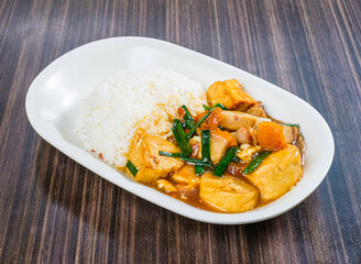 Savor the flavors of Asia with this delectable dish of tofu and pork belly served with rice. Perfect for food blogs, restaurant menus, or culinary projects.