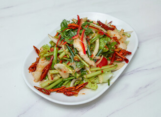 Experience a burst of fresh, vibrant flavors with this exquisitely prepared spicy salad. Packed with crisp vegetables and tender seafood, it's the perfect healthy and delicious choice for any meal.