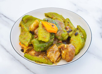 Experience the rich flavors of this savory stir-fry featuring tender chicken, crisp green peppers, and earthy black beans in a delicious sauce. A visually appealing and appetizing dish.