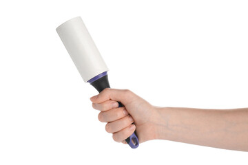 Woman with lint roller on white background, closeup