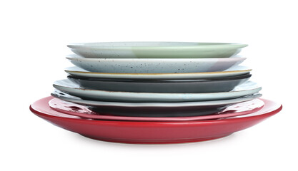 Stack of colorful ceramic plates isolated on white