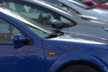 blue car photo, closeup of blue vehicle, photo of small blue car showing details, detailed closeup image of compact blue automobile, highresolution snapshot capturing intricate features of small blue
