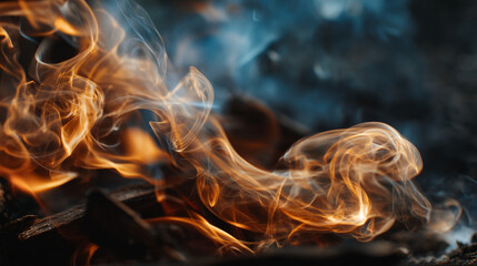 A close up shot of orange flames and smoke rising against a dark blue background texture
