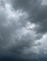 Obraz premium Gloomy sky with heavy, dark gray clouds creating an atmospheric, somber mood, dramatic, melancholic