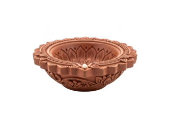 Ornate terracotta diya for festive celebrations and religious occasions. A beautiful terracotta diya with intricate floral carvings, isolated on transparent background