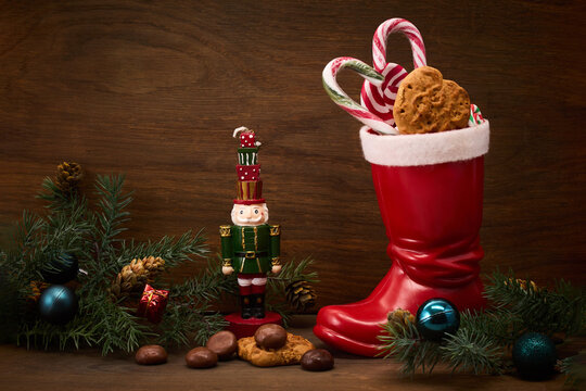 St. Nicholas Day. Red boot with sweets, spicy ginger cookies and gifts for December 6th