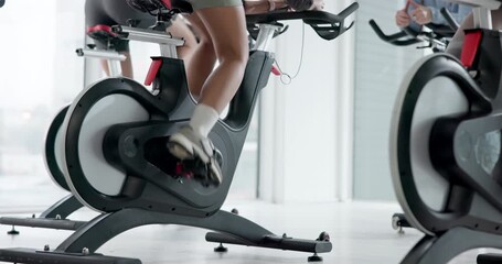 Legs, cycling and health with people in gym for training, elliptical machine and cardio. Wellness, challenge and exercise with athlete on stationery bike in sports center for energy and spin class - Powered by Adobe