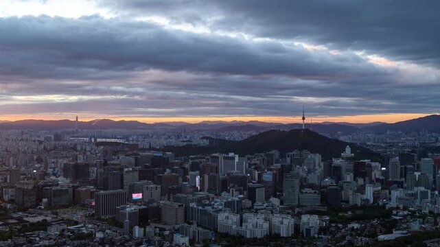 Seoul night to day dramatic timelapse with panoramic cityscape and Namsan Seoul Tower at sunrise