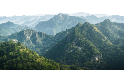 Serene mountain range vista with lush green forests under a misty sky with transparent overlay