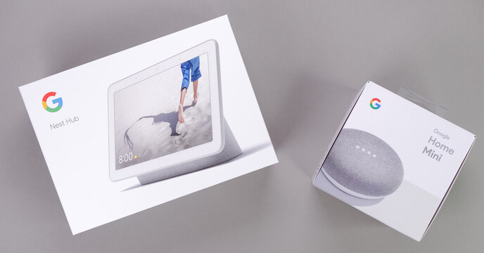 Google Nest Hub and Google Home Mini mock up packaging displayed on gray background, showcasing smart home technology and modern design with copy space
