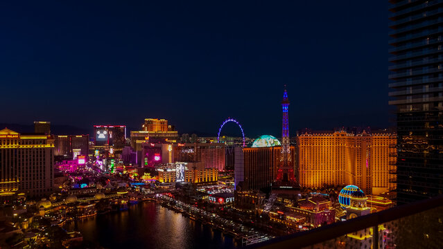 Iconic Sphere in Las Vegas illuminated at night, surrounded by vibrant city lights and famous landmarks, showcasing the dazzling atmosphere of the entertainment capital