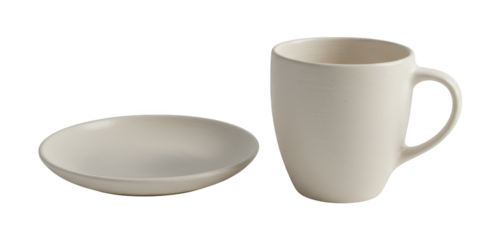 A simple ceramic mug and saucer sit isolated on a black background.