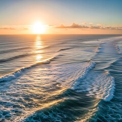 Sunrise over the ocean, showcasing rhythmic waves and golden light reflecting on the water's surface.