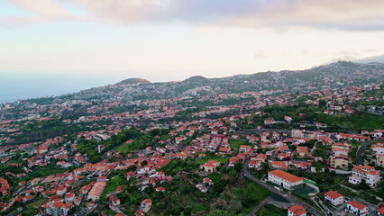 Gloomy coastal resort landscape drone view. Woodland hill town seaside nature