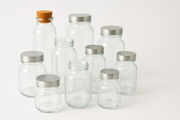 Illustration of collection of empty glass jars isolated on white background for food storage