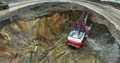 Excavator digging in open pit mine. Stock clip