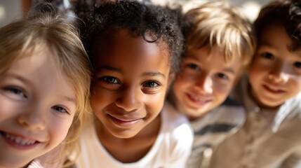 Obraz premium Close-up portrait of four young children, two boys and two girls, standing close together and smiling at the camera. they appear to be of different ages and ethnicities.