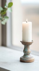 Burning Candle on Rustic Candlestick