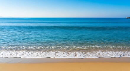 Tranquil ocean waves gently lapping at a sandy beach under a vast, cerulean sky.
