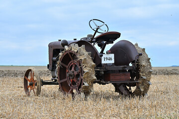 vintage tractor in the field agriculture machinery	
