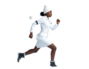 Athletic Black woman in a white winter outfit running with a snowball.