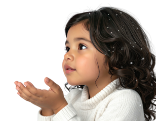 Profile of a beautiful young girl catching snowflakes in her hands.