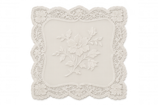 Decorative white lace doily with elegant floral embroidery pattern on textile creating a vintage craft