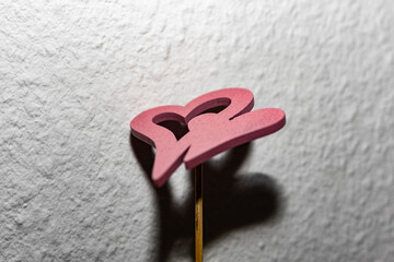 red heart on a wooden surface