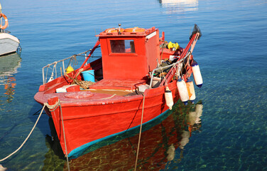 Red fishing boat on the pier