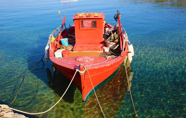 Red fishing boat on the pier