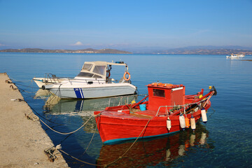 Red fishing boat on the pier