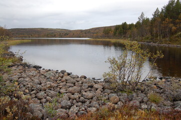 A picturesque lake in the Finnish tundra, Sami territory, amazing nature, Karelia, fantastic landscapes, fishing, tourism.