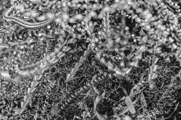 Abstract metal shavings in monochrome displaying industrial art patterns