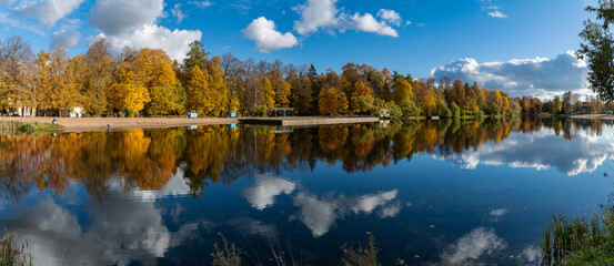 A colorful autumn panoramic landscape with Kolonistsky Pond in Otdelny Park. Pushkin, Saint...