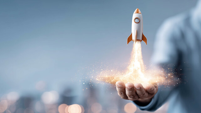 A hand launching a small rocket, representing startup growth product launch momentum and the ignition of innovative ideas into the market.
