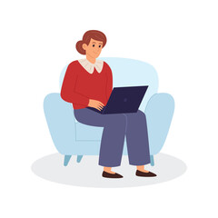 Woman working on laptop while sitting on armchair