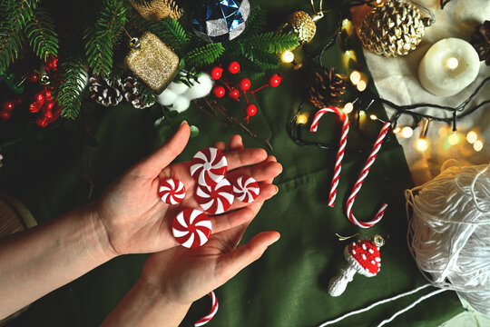 Christmas tree decorations. New Year's toys in the shape of delicious sweet candies. Holiday with children. Cozy home on Christmas eve
