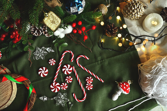 Christmas tree decorations. New Year's toys in the shape of delicious sweet candies. Holiday with children. Cozy home on Christmas eve